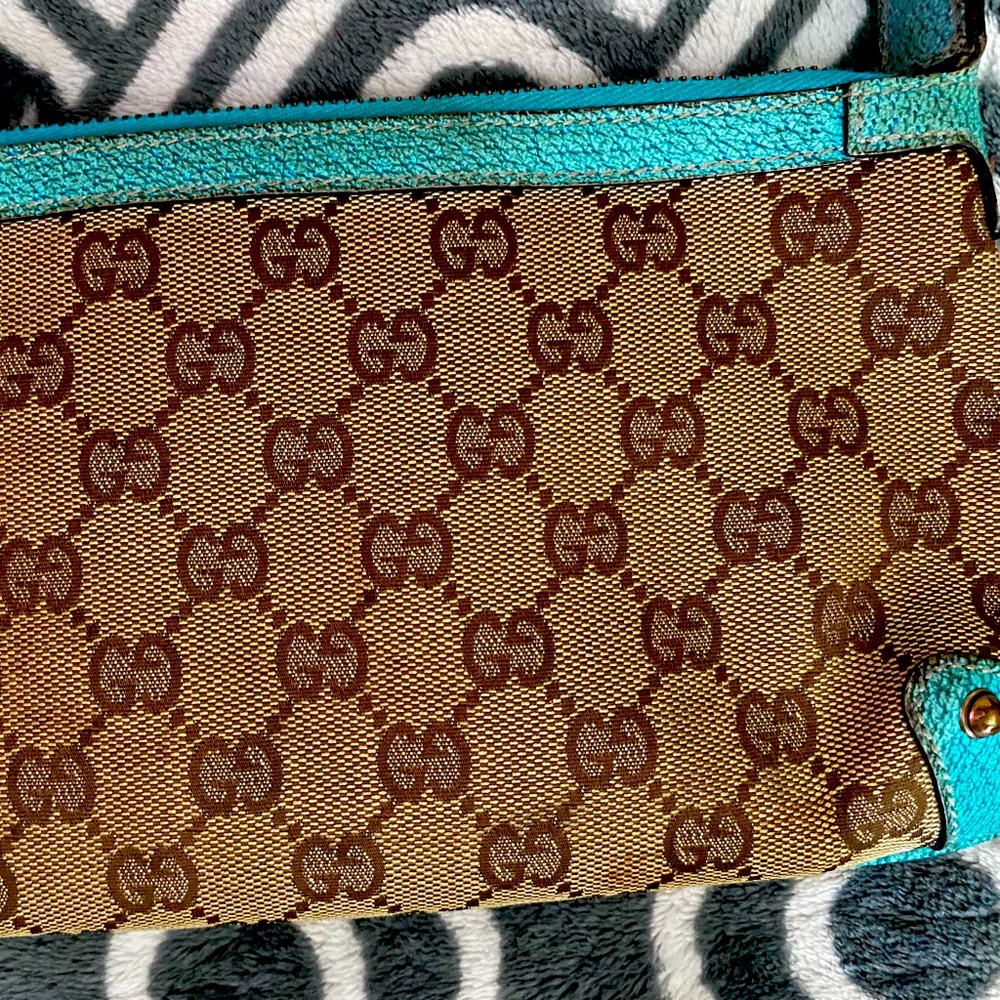 This is a authentic and vintage leather with GG fabric Gucci purse